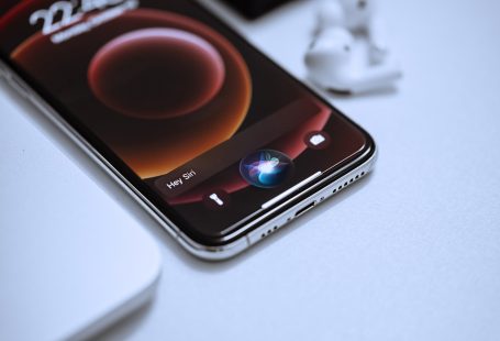 black smartphone on white table