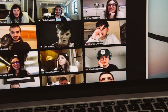 macbook dispalying woman in black shirt