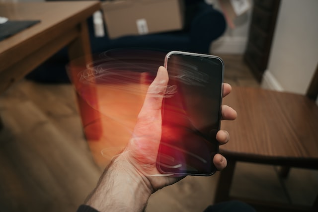 person holding black iphone